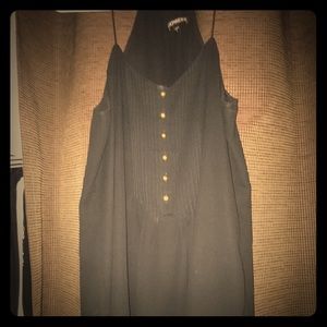 Black sleeveless top.